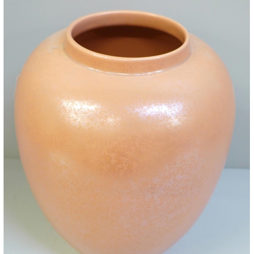 611 - A Poole pottery salmon pink lustre vase, 22cm