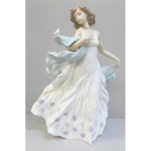 615 - A Lladro figure of a woman with bird, Summer Serenade, 31.5cm