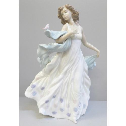 615 - A Lladro figure of a woman with bird, Summer Serenade, 31.5cm