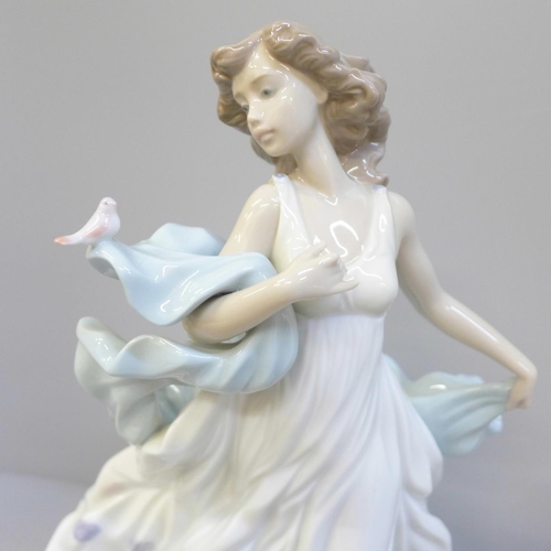 615 - A Lladro figure of a woman with bird, Summer Serenade, 31.5cm