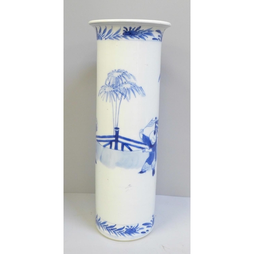 617 - A Chinese blue and white cylindrical vase with flared rim, decorated with figures, with 19th Century... 