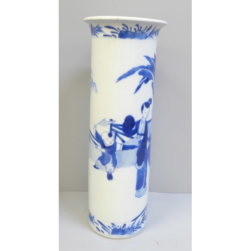 617 - A Chinese blue and white cylindrical vase with flared rim, decorated with figures, with 19th Century... 