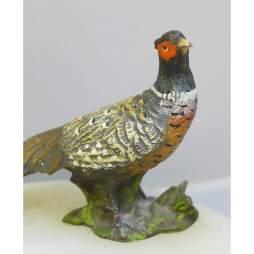 639 - A cold painted bronze model of a pheasant on an onyx ashtray