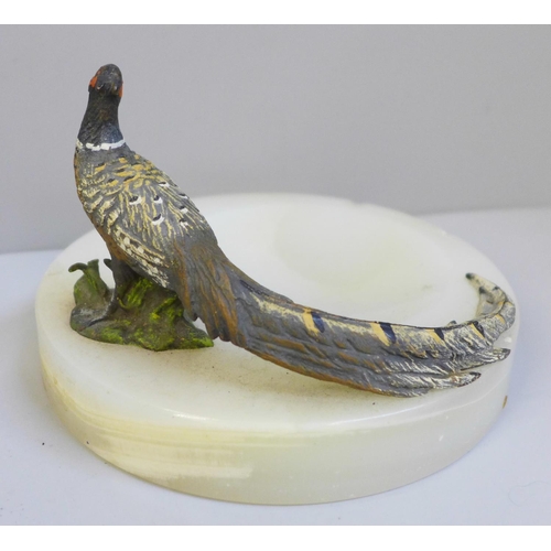 639 - A cold painted bronze model of a pheasant on an onyx ashtray