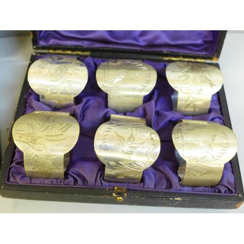 661 - Two sets of six napkin rings, boxed