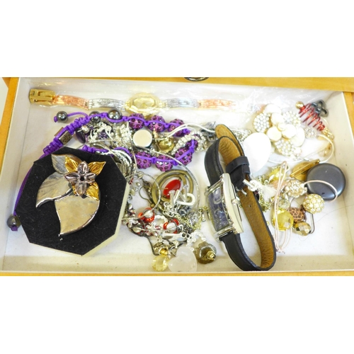 685 - A case of costume jewellery and wristwatches