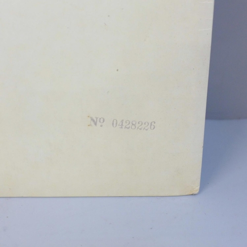 692 - The Beatles White Album, no. 0428266, with original black inner sleeves, poster and four photographs