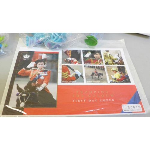 694 - A QE11 Trooping The Colour First Day Cover, a Sun toy figures set of Disney Pixar characters and a D... 