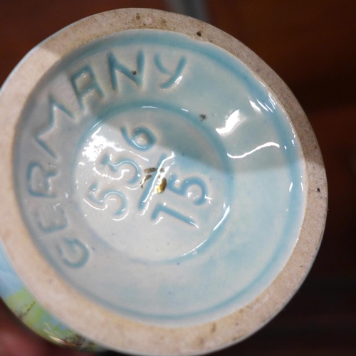 700 - A 19th century cow creamer, two 1950s vases, a Poole Pottery seal and an orange carnival glass bowl