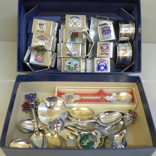 723 - Fifteen napkin rings and fourteen spoons, all with various Coats of Arms