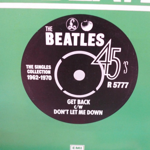 724 - A box containing thirty five The Beatles 45rpm 7