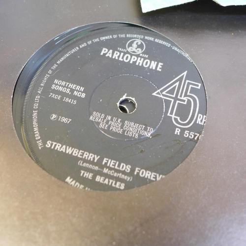 724 - A box containing thirty five The Beatles 45rpm 7