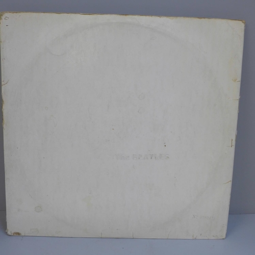 725 - The Beatles White Album, no. 0282479, with original black inner sleeves, poster and four photographs