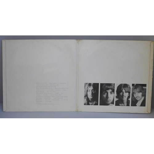 725 - The Beatles White Album, no. 0282479, with original black inner sleeves, poster and four photographs