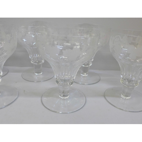 727 - A set of six large glasses with etched decoration of grapes and vines