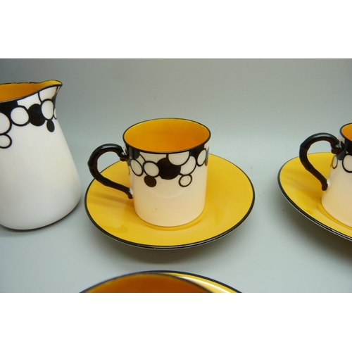 728A - A Royal Worcester six setting Art Deco coffee service, one cup cracked, with six coffee bean spoons