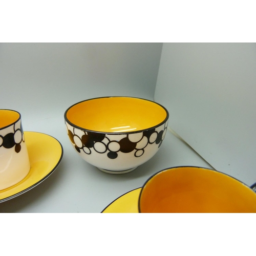 728A - A Royal Worcester six setting Art Deco coffee service, one cup cracked, with six coffee bean spoons