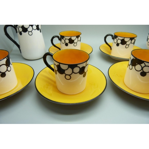 728A - A Royal Worcester six setting Art Deco coffee service, one cup cracked, with six coffee bean spoons