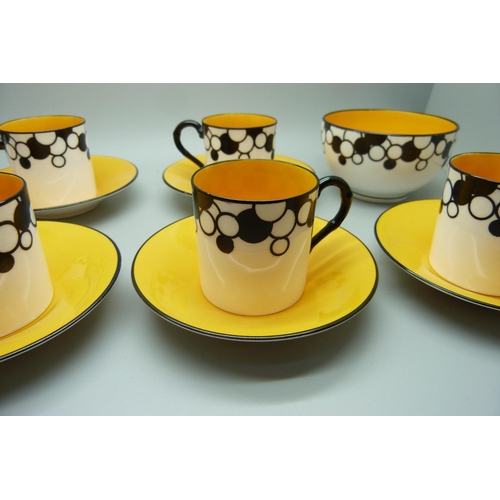 728A - A Royal Worcester six setting Art Deco coffee service, one cup cracked, with six coffee bean spoons