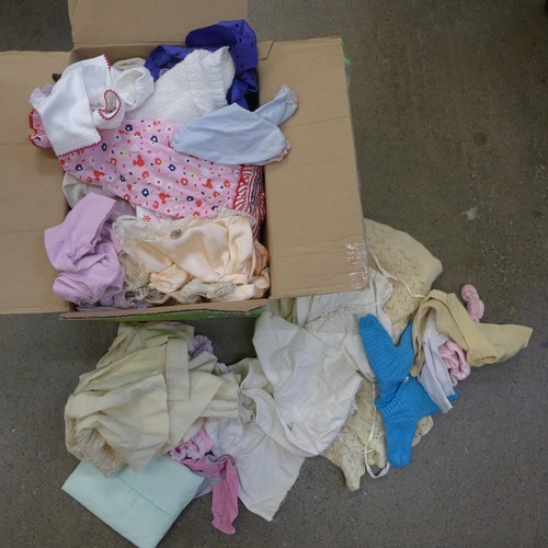 744 - A box of vintage doll's clothes