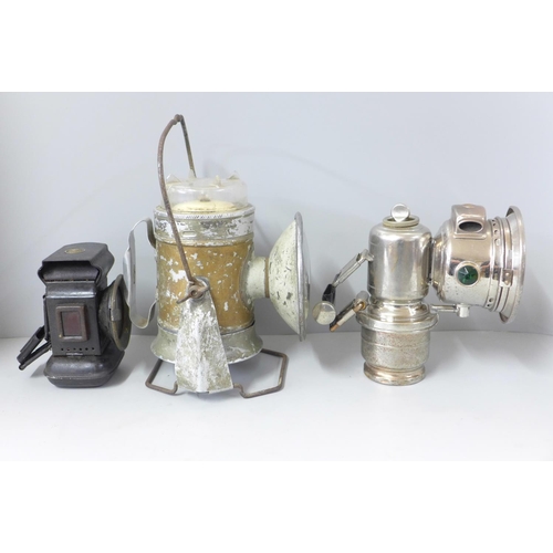 806 - A vintage Lucas Calica lamp, another early lamp and a railway lamp