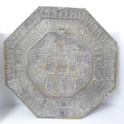 808 - An Indian embossed octagonal brass plaque, 59cm