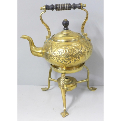 815 - An Arts & Crafts brass spirit kettle and stand