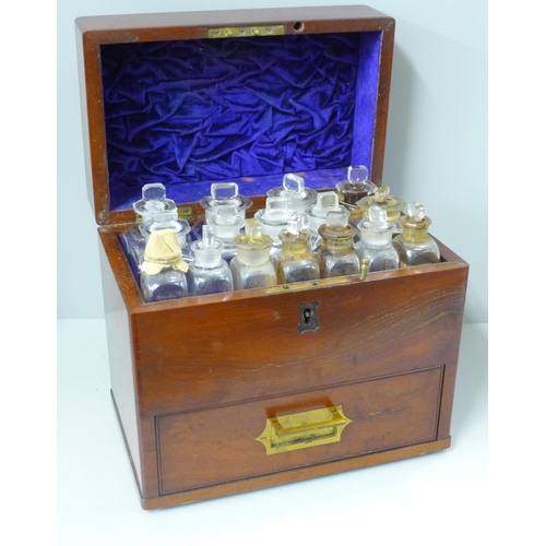 816 - A 19th Century mahogany apothecary chest/box with campaign handle, includes sixteen fitted bottles, ... 