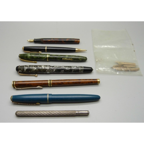 855 - Eleven 18ct rolled gold pen nibs, four pens with 14ct gold nibs, one lacking top, etc.