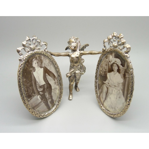 858 - A silver double photograph frame, bevelled glass, Chester import mark, frames 6cm wide