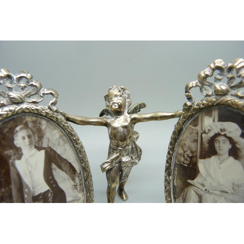 858 - A silver double photograph frame, bevelled glass, Chester import mark, frames 6cm wide