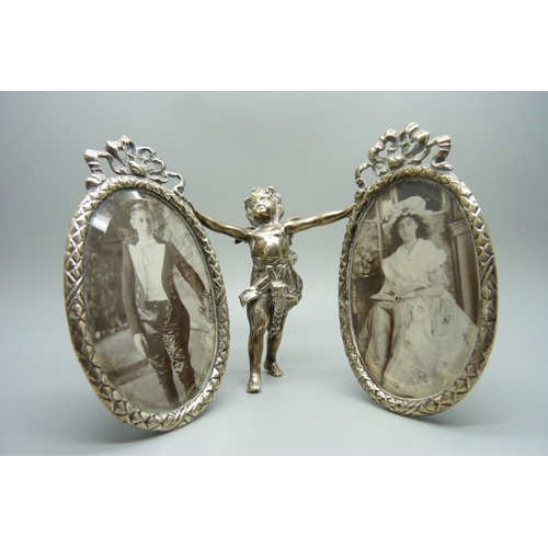 858 - A silver double photograph frame, bevelled glass, Chester import mark, frames 6cm wide