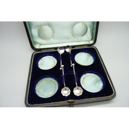 876 - A cased set of four silver salts and two pairs of silver spoons, 53g