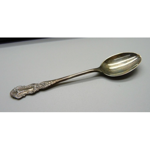 878 - A silver ladle and a cased set of six silver coffee spoons, 102g