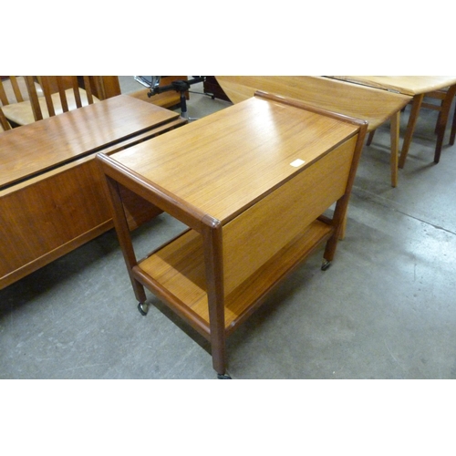 100 - A teak two tier drop leaf cocktail trolley