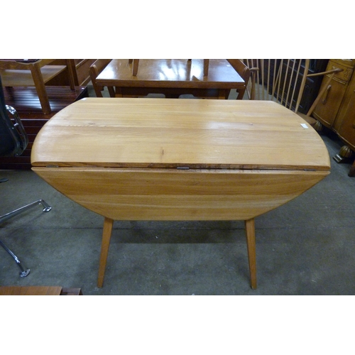 103 - An Ercol Blonde elm and beech drop leaf table