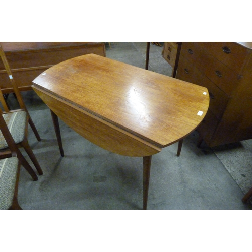 106 - A teak drop leaf table