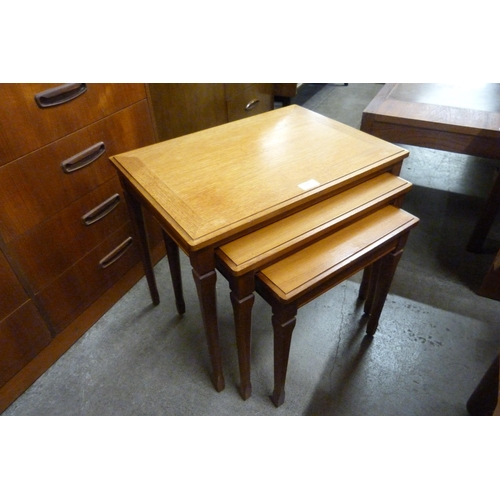 114 - A teak nest of tables