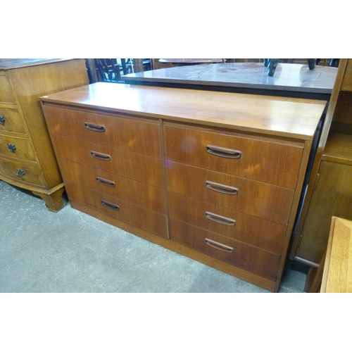 115 - A teak chest of drawers