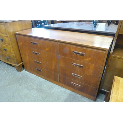 115 - A teak chest of drawers