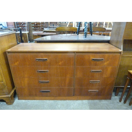 115 - A teak chest of drawers