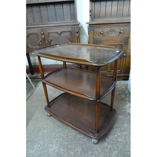 117 - An Ercol Golden Dawn elm and beech Windsor trolley