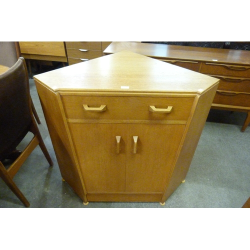 120 - A G-Plan Brandon oak secretaire corner cabinet