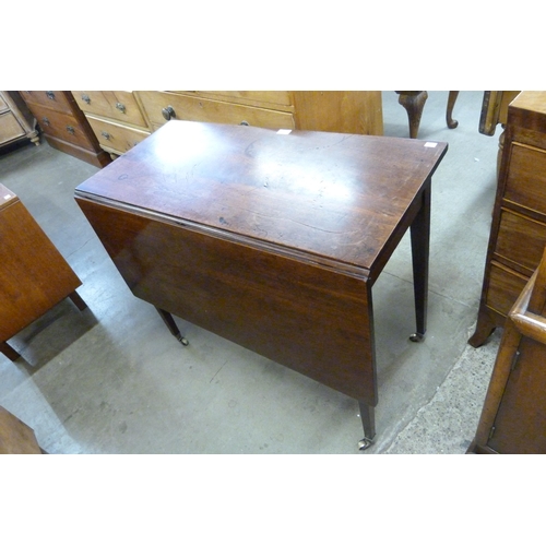 134 - A George III mahogany single drawer drop leaf side table