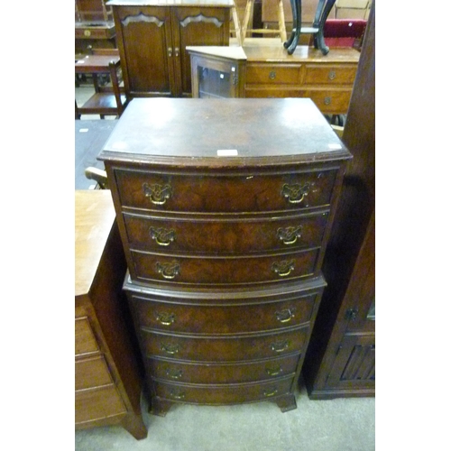 136 - A George III style mahogany burr walnut chest of drawers