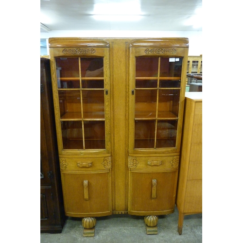 139 - A carved oak four door bookcase