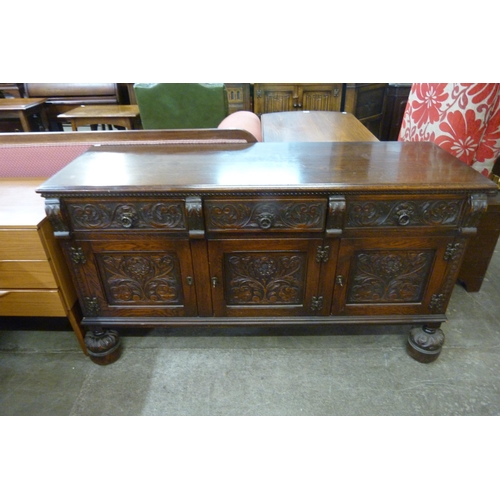 140 - A 17th Century style Jaycee carved oak sideboard