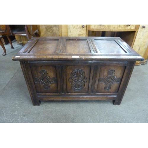 141 - A small 17th Century style carved oak coffer