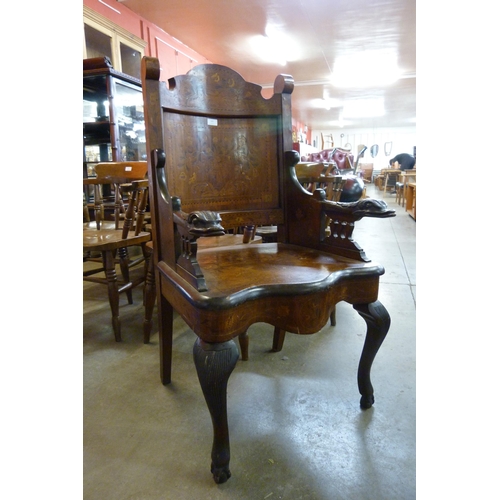 143 - A 19th Century Dutch inlaid walnut carved armchair