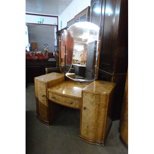 146 - An Art Deco figured walnut three door wardrobe and matching dressing table